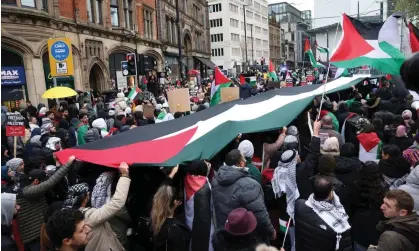  ?? ?? Protesters hold up a Palestinia­n flag during a rally in Manchester on 4 November 2023. Photograph: Adam Vaughan/EPA