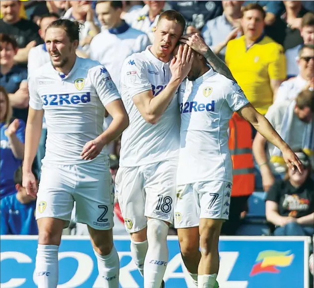  ?? PICTURES: Camera Sports ?? ROOFE JUSTICE: Leeds midfielder Kemar Roofe, right, gets a hug from Pontus Jansson after scoring the opening goal
