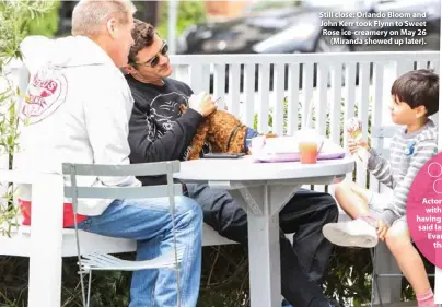  ??  ?? Still close: Orlando Bloom and John Kerr took Flynn to Sweet Rose ice-creamery on May 26 (Miranda showed up later).