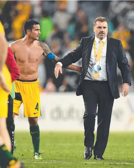 ?? Picture: AAP IMAGES ?? Australia's Tim Cahill with coach Ange Postecoglo­u following the Socceroos’ win over Syria this week.