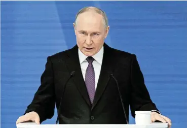  ?? Sputnik/Sergey Guneev/Kremlin via Reuters ?? Not a cartoon: President Vladimir Putin delivers his annual address to the Federal Assembly in Moscow on Thursday, in which he dismissed Western suggestion­s that Russian forces might attack European countries as ‘nonsense’ ./