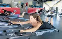  ?? Allen J. Schaben Los Angeles Times ?? STACY Guglielmi works out in a Gravity class at 220 Fitness.