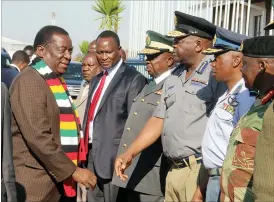  ??  ?? Service Chiefs greet President Mnangagwa on his arrival from Qatar yesterday