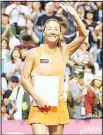  ?? (AFP) ?? Japan’s Kimiko Date wave to her fans during a ceremony after her last match of her career against Serbian Aleksandra Krunic in the first round of the Japan Women’s Open tennis tournament in Tokyo
on Sept 12.