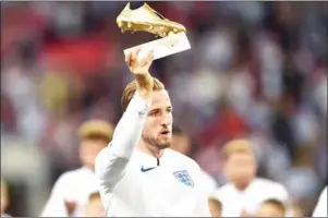  ?? AFP ?? England striker Harry Kane holds aloft the Golden Boot award for being top goalscorer at the 2018 World Cup ahead of their Nations League match with Spain on Saturday.