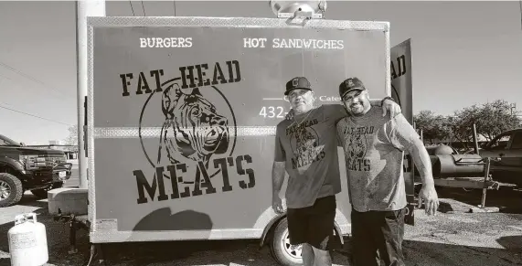  ?? Jacob Ford / Odessa American ?? Longtime friends Rory Couch and Junior Hernandez say their Odessa business, Fat Head Meats, has gradually taken off in the area. They launched their mobile food trailer five months ago, with burgers, sandwiches and party platters drawing fans.