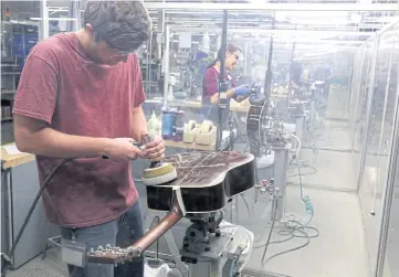  ??  ?? POLISH IT UP: Above left, workers buff guitars at CF Martin and Co, in Nazareth, Pennsylvan­ia.