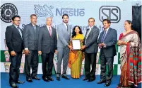  ??  ?? Nespray Nutri-up team receiving the SLS Certificat­ion Award