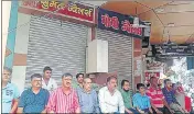  ?? HT PHOTO ?? Jewellers sitting outside their shut shops in Chowk area of Prayagraj on Monday.