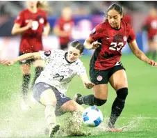  ?? — AFP photo ?? Emily Fox (left) of the US kicks the ball while being chased by Canada’s Olivia Smith during the Concacaf Women’s Gold Cup semifinals at Snapdragon Stadium in San Diego, California.