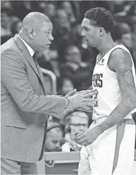  ?? JAYNE KAMIN-ONCEA/USA TODAY SPORTS ?? Doc Rivers talks with Lou Williams, who has won the NBA’s Sixth Man of the Year honor twice.