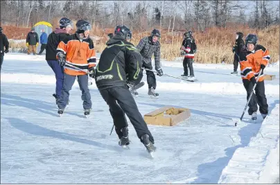  ?? ERIC MCCARTHY/JOURNAL PIONEER ?? Action from last year’s P.E.I. pond hockey championsh­ip tournament. Although the venue is moving to the Mill River Resort this year, it remains a major fundraiser for the West Point Fire Department.