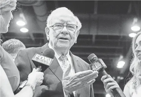  ??  ?? Warren Buffett, chairman and CEO of Berkshire Hathaway, speaks to reporters Saturday in Omaha. NATI HARNIK/AP