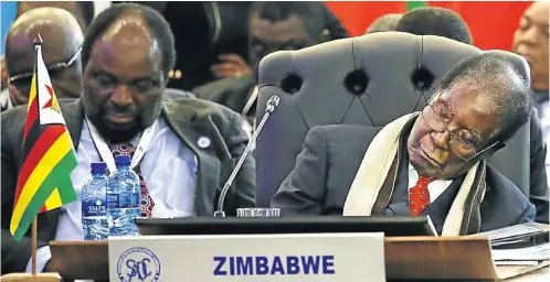  ?? Picture: Alon Skuy ?? Zimbabwe’s President Robert Mugabe takes a nap during proceeding­s at the Southern African Developmen­t Community summit in Pretoria yesterday.