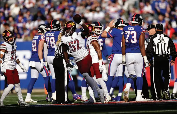  ?? ADAM HUNGER / ASSOCIATED PRESS ?? Washington Commanders linebacker Jamin Davis (52) reacts Dec. 4 after recovering a fumble by the New York Giants in East Rutherford, N.J. The two teams play again Sunday.