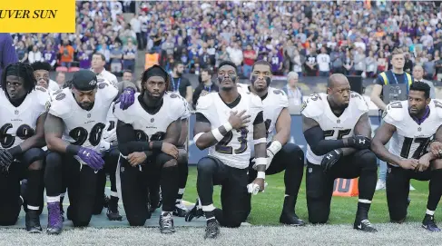  ?? MATT DUNHAM / THE ASSOCIATED PRESS ?? Baltimore Ravens players kneel during the U.S. national anthem before an NFL game against Jacksonvil­le at Wembley Stadium on Sunday.