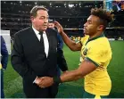  ??  ?? Steve Hansen, left, congratula­tes Will Genia after the match.