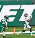  ?? AP PHOTO/NOAH K. MURRAY ?? Las Vegas Raiders receiver Henry Ruggs III, right, makes a touchdown catch in the final seconds against the host New York Jets on Dec. 6. Trailing on the play is defensive back Lamar Jackson.