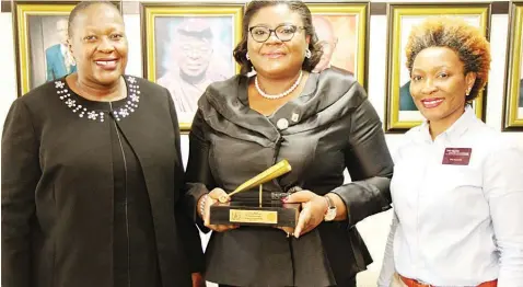  ??  ?? General Counsel and Head of Regulation, The Nigerian Stock Exchange (NSE), Tinuade Awe(left); Country Vice-president/national President, Inime I. Aguma, and Ag. Head, Corporate Services Division, NSE, Pai Gamde, at the Closing Gong Ceremony on Friday.