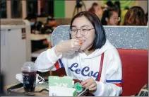  ?? PROVIDED TO CHINA DAILY ?? A customer tries KFC’s plant-based chicken nuggets at a KFC store in Shanghai.