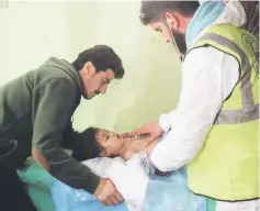  ??  ?? File photo shows an unconsciou­s Syrian child receiving treatment at a hospital in Khan Sheikhun, a rebel-held town in the northweste­rn Syrian Idlib province, following a suspected toxic gas attack. — AFP photo