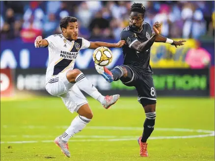  ?? Kelvin Kuo Associated Press ?? MIDFIELDER Jonathan dos Santos, left, is ready to bounce back from an injury-shortened 2020 that made him consider retirement.