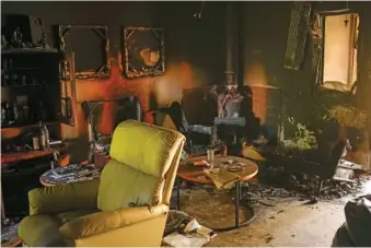  ?? AP PHOTO/FRANCISCO SECO ?? Destroyed furniture and charred walls are seen Thursday in a home that came under attack during a massive Hamas invasion into Kibbutz Nir Oz, Israel.