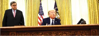  ?? — AFP photo ?? Trump (right) speaks as US Attorney General William Barr listens before signing an executive order on social-media companies in the Oval Office of the White House.