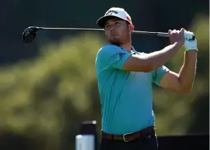  ?? The Associated Press ?? Q Sam Burns tees off on the ninth hole during the second round of the Genesis Invitation­al at Riviera Country Club Friday in the Pacific Palisades area of Los Angeles.