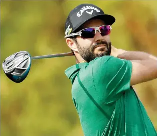  ?? CHRIS CARLSON/THE ASSOCIATED PRESS ?? Adam Hadwin watches his tee shot on the fifth hole during the final round of the Desert Classic on the Stadium Course at PGA West on Sunday in La Quinta, Calif.