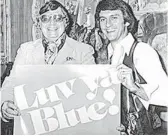  ??  ?? Mack Hayes, shown at left with Oilers owner Bud Adams, recorded “Luv Ya Blue” in 1979, then recorded “Go, Go Astros” a year later.