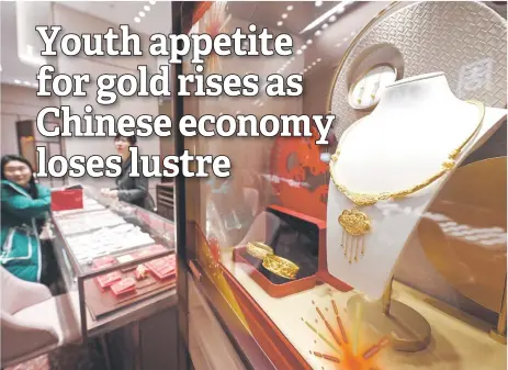  ?? — AFP photos ?? Gold jewellery for sale at a Chow Tai Fook store in Beijing.