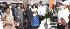  ?? — ?? First Lady Dr Auxillia Mnangagwa interacts with exhibitors while Minister of Environmen­t, Climate, Tourism and Hospitalit­y Industry Mangaliso Ndlovu (with hat) and his Democratic Republic of Congo counterpar­t Modero Nsimba Matondo (third from left) and other dignitarie­s look on at the official opening of the Sanganai/ Hlanganani World Tourism Expo in Bulawayo on Friday. Pictures: John Manzongo