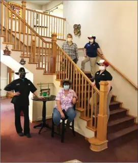  ?? PHOTOS Provided ?? In March we celebrated Employee Spirit Week and this was Cowboy Day. On stairs: Diane Ragsdale, Maryssa Guzman & Katie Byrd. Next to stairs: Anna Corbett and Christy Graham