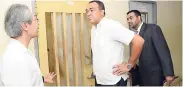  ?? RUDOLPH BROWN/PHOTOGRAPH­ER ?? Dr Myo Kyaw Oo (left) chats with Minister of Health Dr Christophe­r Tufton (centre) and Dr Winston De La Haye, chief medical officer, during a tour of a section of the Bellevue Hospital last December.