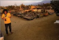  ??  ?? A homeowner, wishing not to be identified, stands in front of his fire-ravaged home Saturday after the Bobcat Fired passed through in Juniper Hills, Calif. (AP Photo/ Marcio Jose Sanchez)