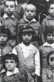  ?? Jewish Partisan Educationa­l Foundation ?? Sonia Orbuch (center), shown in a class photo taken when she was about 9, helped fight the Nazis at 16.