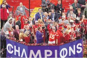  ?? ASSOCIATED PRESS ?? Kansas City Chiefs quarterbac­k Patrick Mahomes (15) lifts the Vince Lombardi Trophy after the team’s victory over the San Francisco 49ers in Super Bowl 58 on Sunday in Las Vegas.