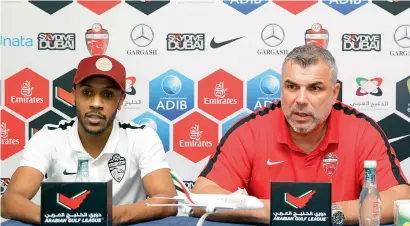  ?? Photo by Juidin Bernarrd ?? Al Ahli coach Cosmin Olaroiu and player Saeed Ahmed during the conference at Nad Al Sheba Sports Complex. —
