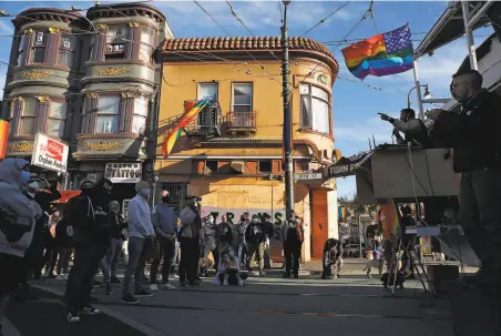  ?? Photos by Scott Strazzante / The Chronicle ?? A Castro Street crowd celebrates Monday’s ruling that protects gay, lesbian and transgende­r employees from job discrimina­tion.