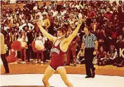  ??  ?? Andre Metzger celebrates a victory while wrestling for OU.
[PHOTO PROVIDED]