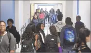  ?? H John Voorhees III / Hearst Connecticu­t Media file photo ?? Students fill a hallway at Danbury High School. Superinten­dents and teachers say more time is needed before schools reopen.