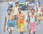  ?? CHANDAN PAUL/HT PHOTO ?? Labourers arrive in Dhanbad in search for jobs amid the Covid-19 pandemic.