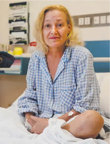  ?? Picture: STEWART McLEAN ?? NASTY SHOCK: Yorkeys Knob woman Vicki McCarthy in Cairns Hospital after being bitten by a snake while watering her garden barefoot at night.