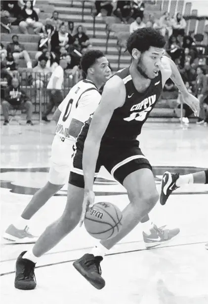  ?? BARBARA HADDOCK TAYLOR/BALTIMORE SUN ?? Coppin State guard Brendan Medley-Bacon dribbles down the court in the first half Saturday.