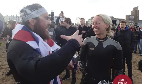  ?? GAVIN PARISH ?? Helen catches up with Ross Edgley at the finish of his 1,792-mile Great British Swim. She joined Ross as part of a group of 300 swimmers invited to complete the historic last mile with him.