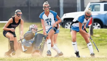  ?? DYLAN SLAGLE/BALTIMORE SUN MEDIA GROUP ?? Westminste­r’s Alli Zimmerman, right, works near the goal during the second half of the host Owls’ 7-2 win over Winters Mill.