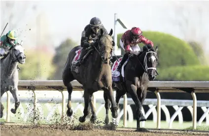  ?? SILAS WALKER swalker@herald-leader.com ?? Sierra Leone, with Tyler Gaffalione up, wins the 100th Toyota Blue Grass Stakes, a 200-point Kentucky Derby qualifier, on the second day of Keeneland’s Spring Meet on Saturday.