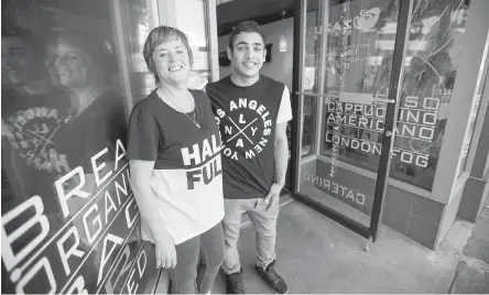  ??  ?? Rateb with Zazu Cafe owner, Tracey Higgins. He says when he first met her, she told him: “‘Just be happy, nothing is going to happen.’ She’s always behind me.” Higgins is organizing a fundraiser to raise enough money to privately sponsor Rateb’s family.