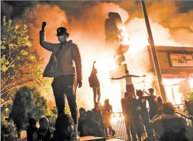  ?? ?? Uncivil war: Democrats excused the violent riots during 2020 — such as seen here in Minneapoli­s — as “mostly peaceful” and the legitimate voice of the people, despite billions of dollars in damage and dozens of deaths.
